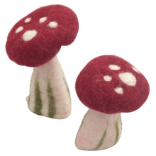 2 felted red and white mushrooms on a white background