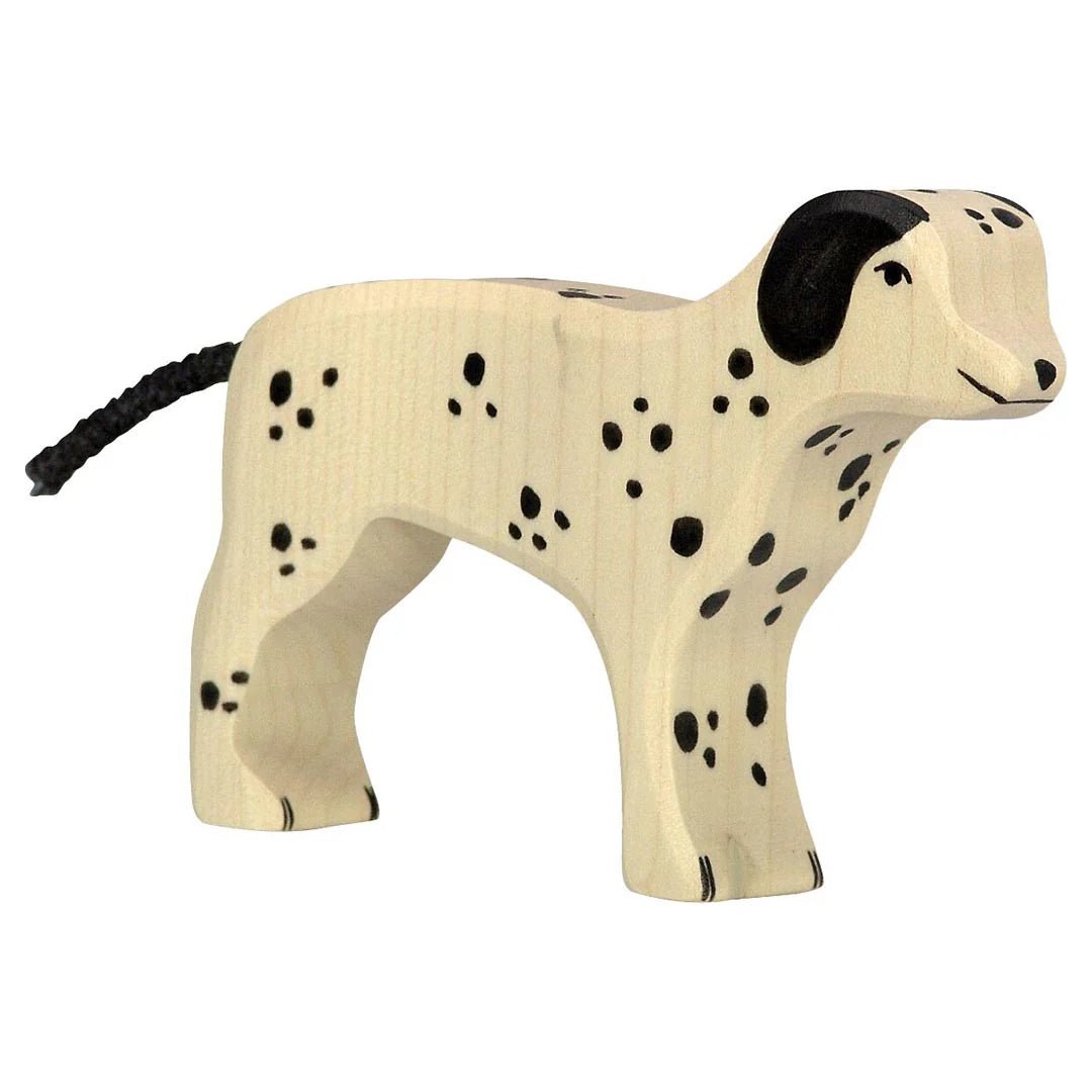 Wooden holztiger dalmatian toy dog with black spots on a white background
