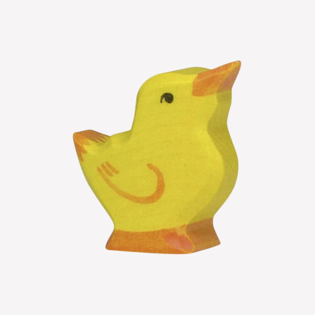 Yellow wooden chick on a white background