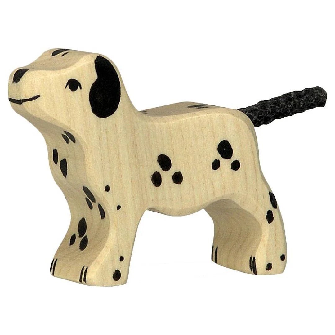 Wooden dog toy with black spots on a white background