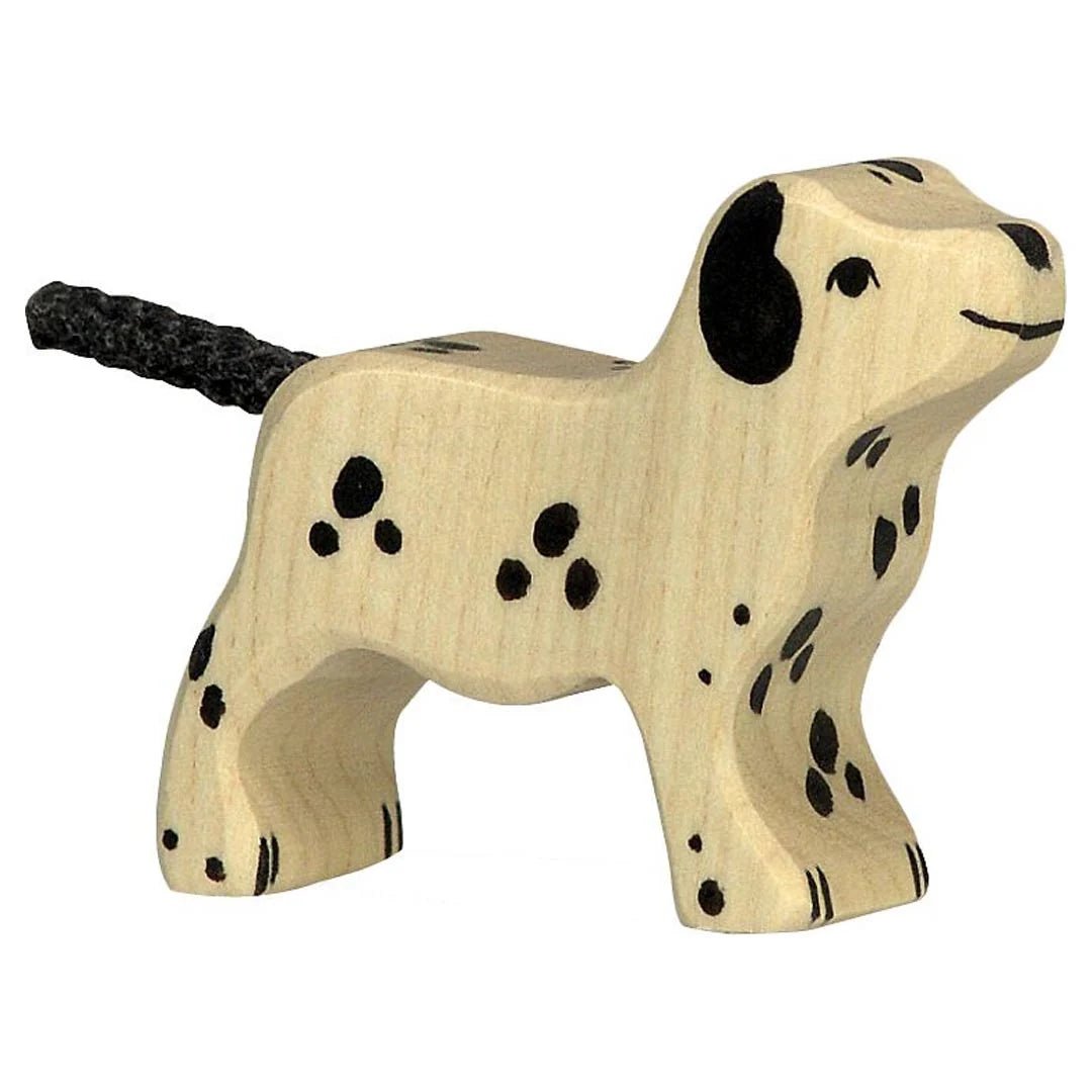 Wooden toy dalmation figure on a white background