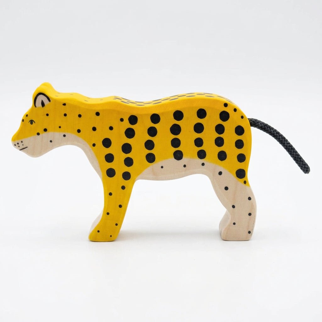 Wooden toy leopard on a white background