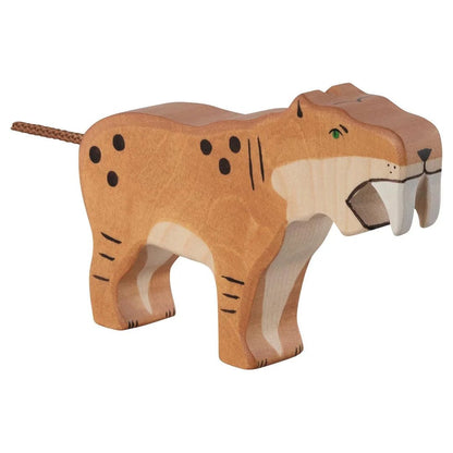 Wooden saber-toothed tiger toy figure on a white background