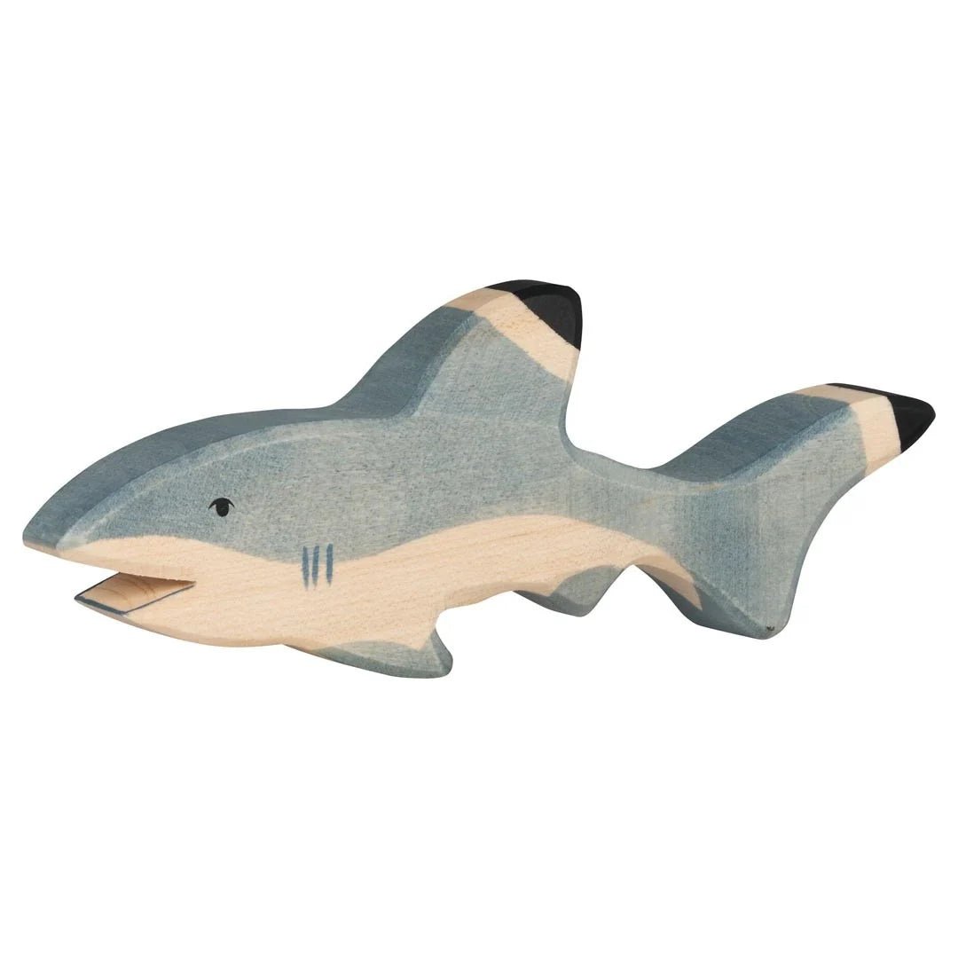 Wooden toy shark on a white background