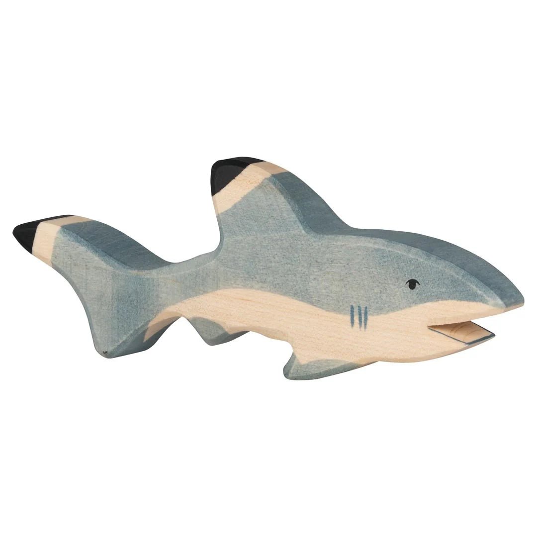 Wooden shark toy on a white background