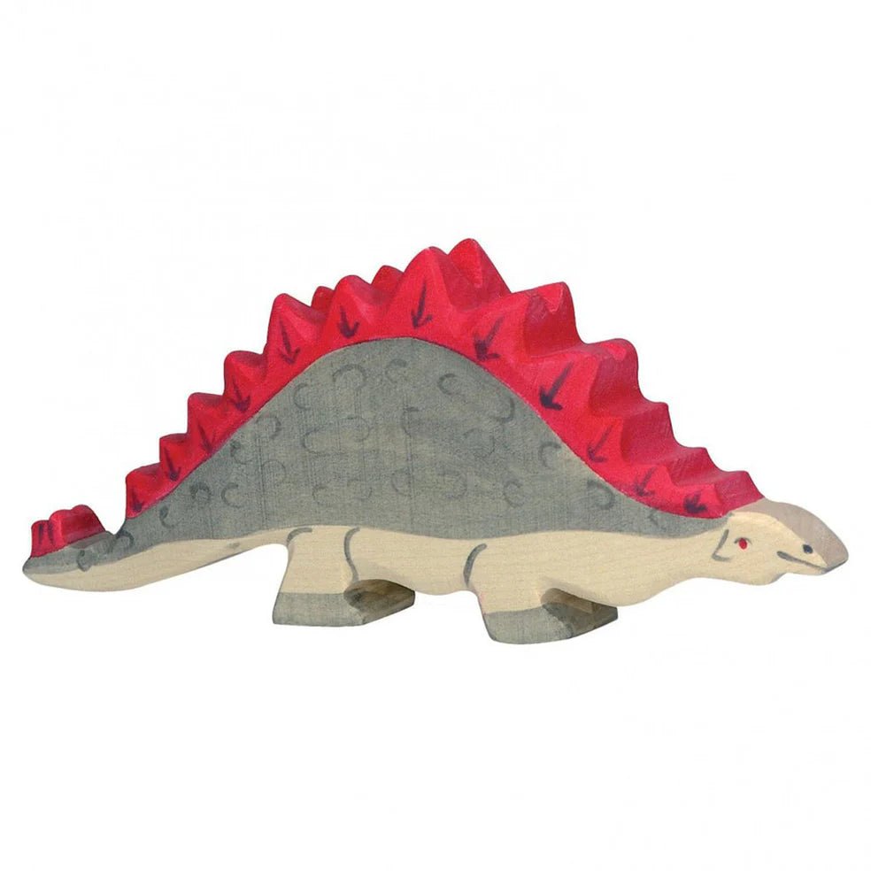 Wooden toy stegosaurus dinosaur with red spikes on a white background