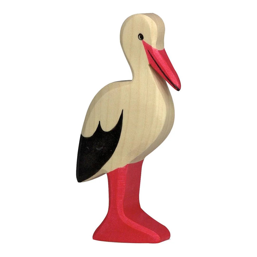 Wooden stork figurine with a red beak and legs on a white background