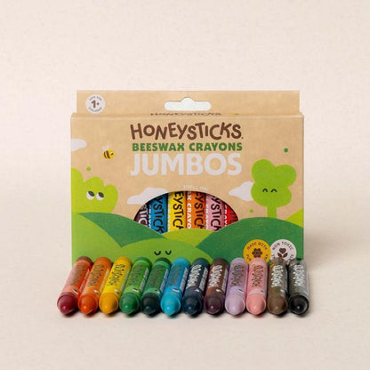 Pack of Honeysticks Beeswax Crayons Jumbos with colorful crayons on a beige background