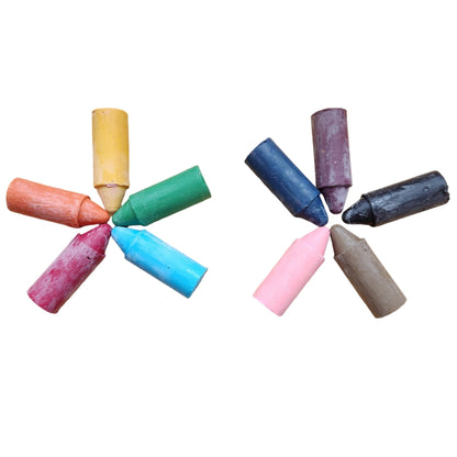 Assorted colorful beeswax crayon tips on a white background