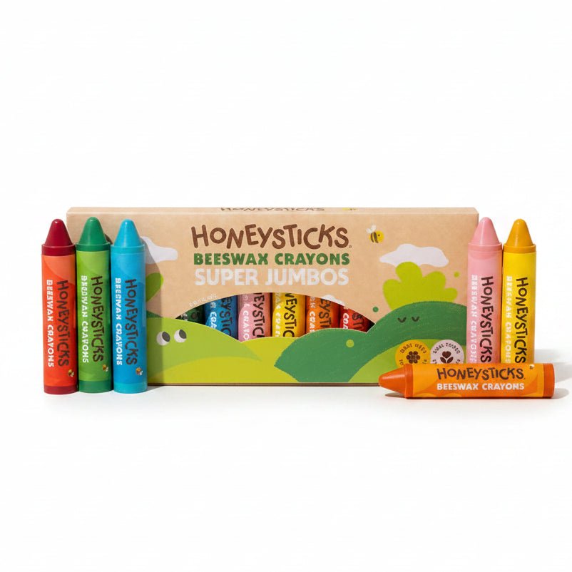 A box of Honeysticks Beeswax Crayons Super Jumbos with several crayons displayed in front on a plain white background.