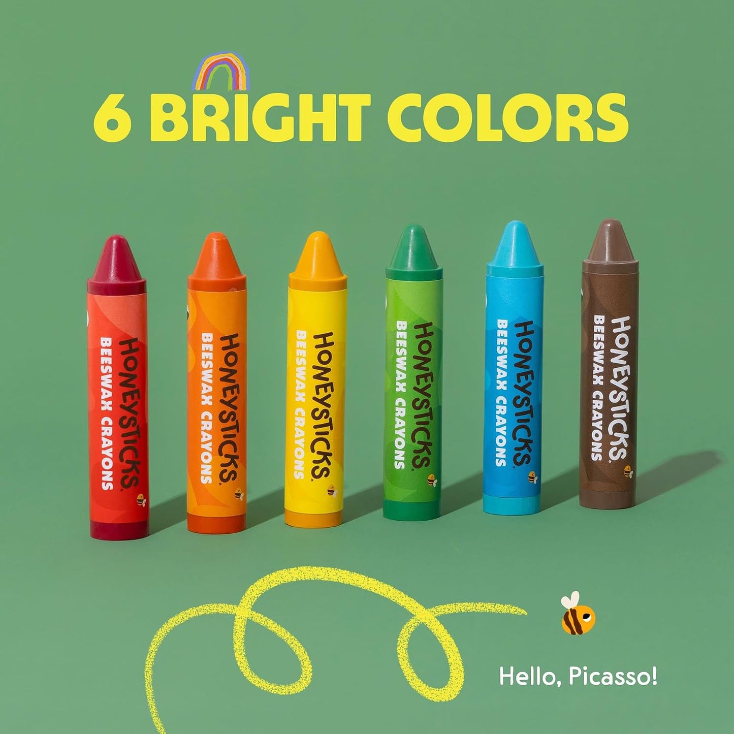 6 colors of Honeysticks super jumbo crayons on a green background