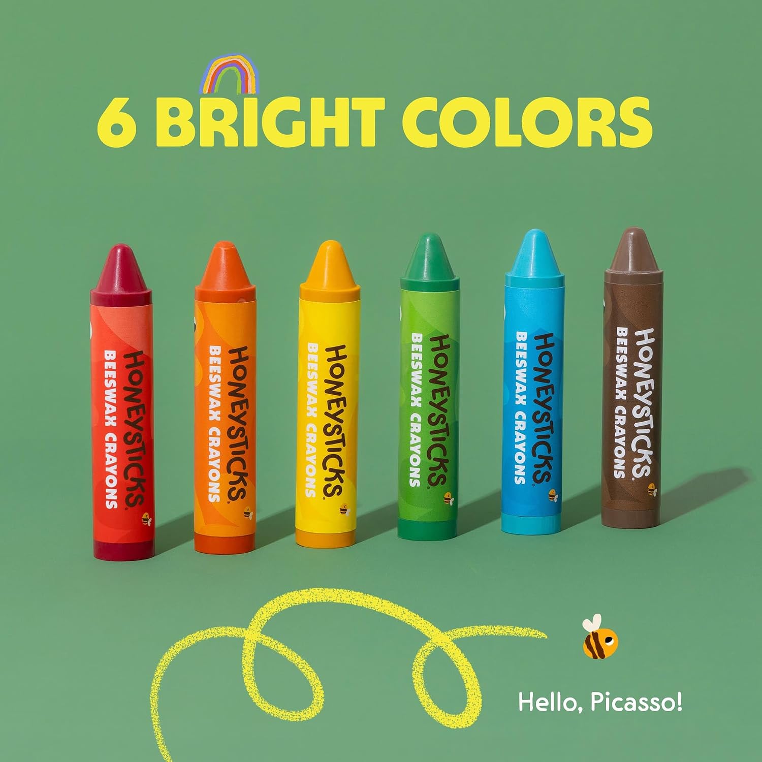 6 colors of Honeysticks super jumbo crayons on a green background