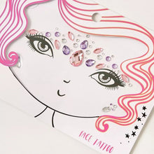 Close up view of Snails face tattoo with purple, pink, and clear gems