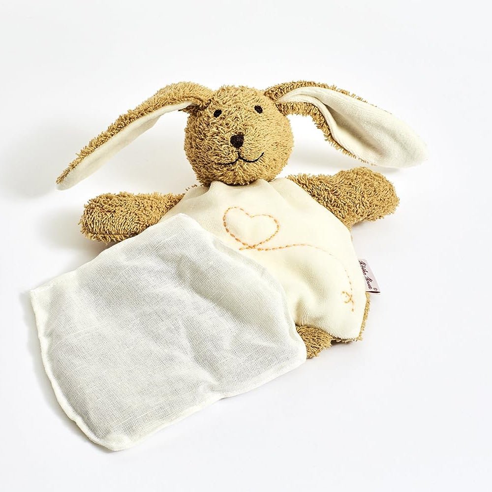 A plush bunny lovey comforter featuring a brown textured bunny head and ears with a cream-colored soft blanket draped over it, decorated with a small embroidered heart.