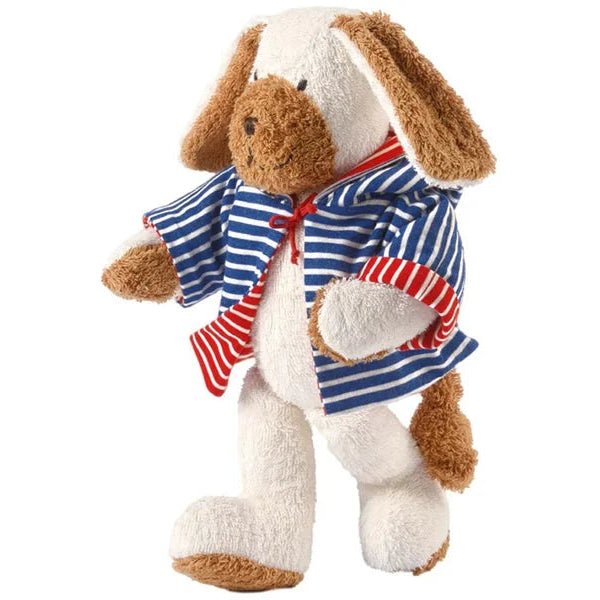 A plush stuffed dog toy with long floppy brown ears and a cream-colored body, wearing a blue and white striped shirt with a red striped tie, photographed on a plain white background.