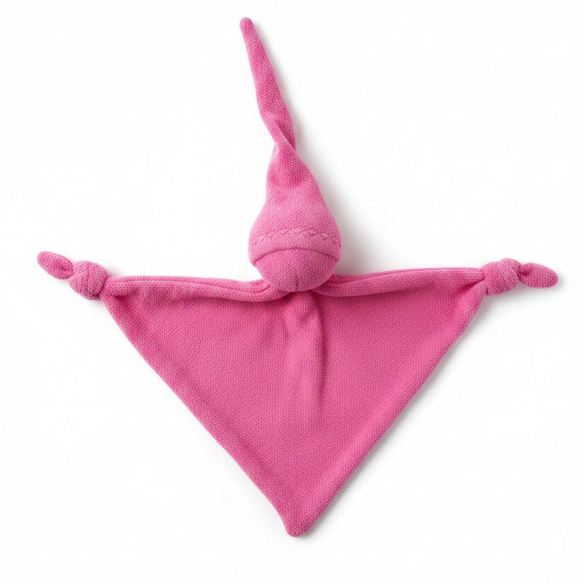 Fuchsia doll by Keptin Jr. on a white background