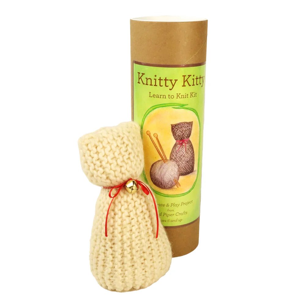Knitted cat toy with a 'Knitty Kitty' learn to knit kit on a white background