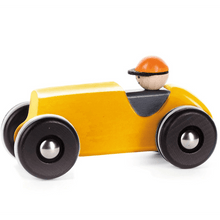Yellow toy car with a driver figure on a white background