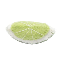 Felted lime wedge on a white background