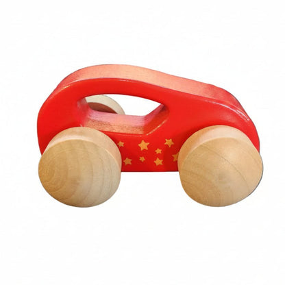A small wooden toy car with a red painted body, yellow star details, and natural light wood wheels on a white background