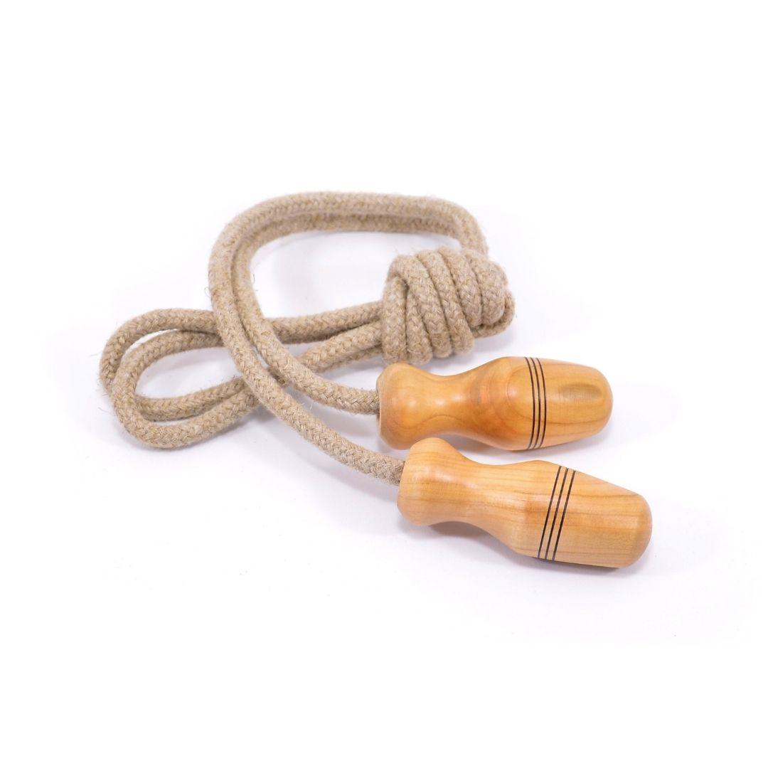 Jump rope with beige rope and wooden handles on a white background