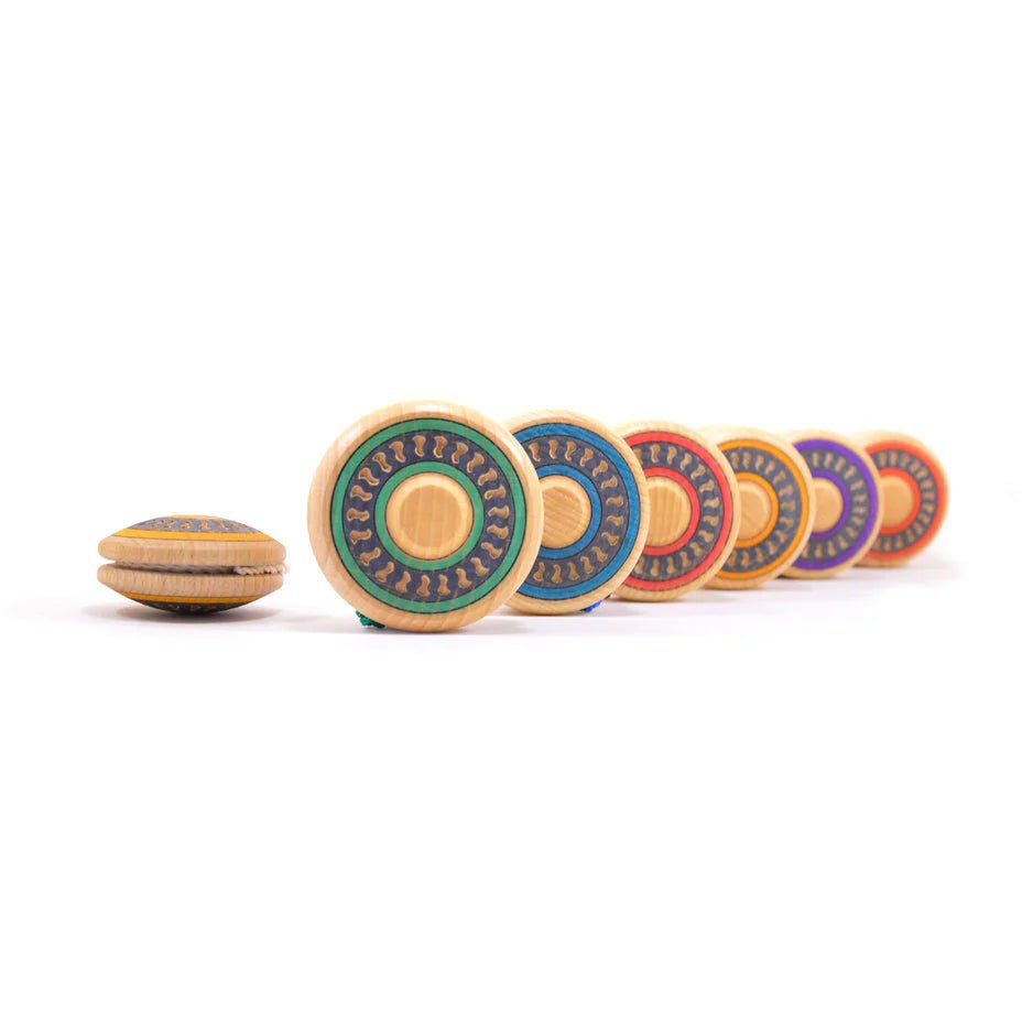 Set of colorful wooden yoyos on a white background