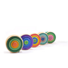 Set of colorful wooden yoyos on a white background