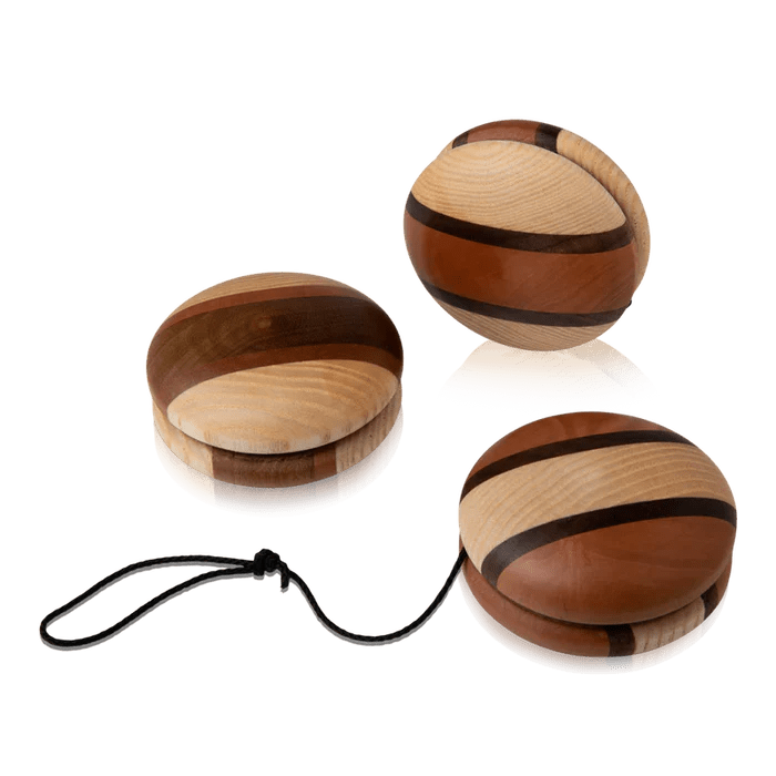 Three wooden multi-tone yoyos on a white background