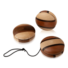 Three wooden multi-tone yoyos on a white background