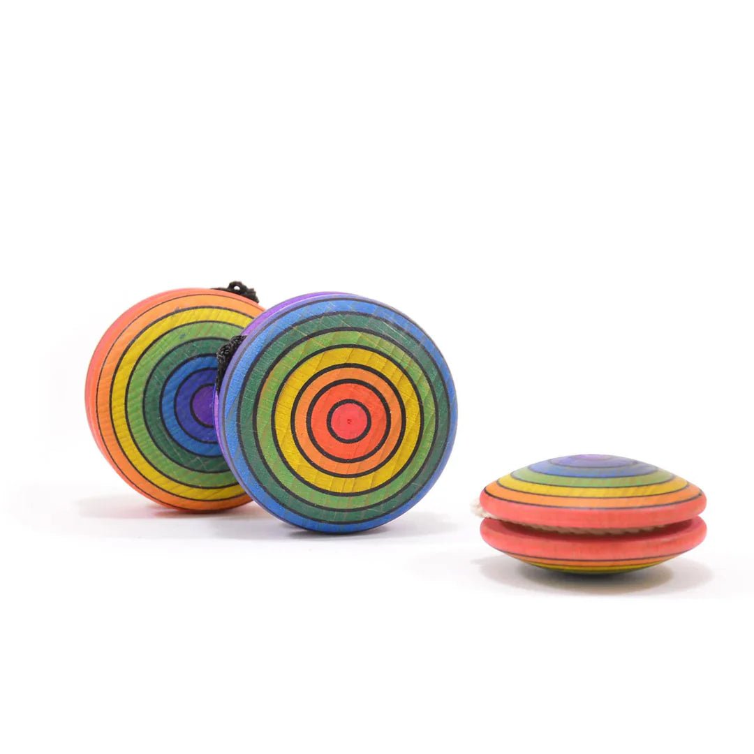 Colorful rainbow striped yoyos on a white background