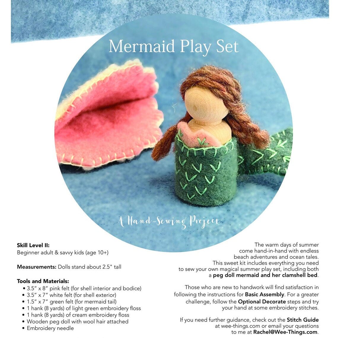Mermaid play set with a mermaid doll and pink clam shell on a blue background with materials included in kit