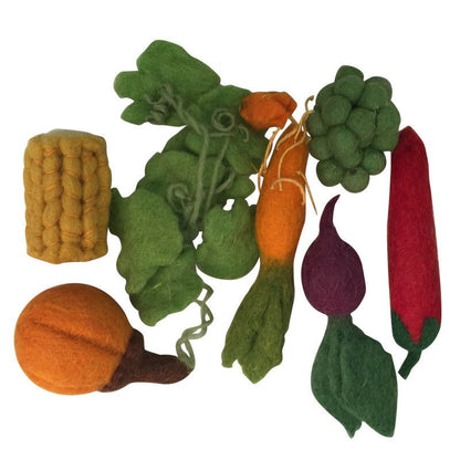 Variety of felt vegetables on a white background