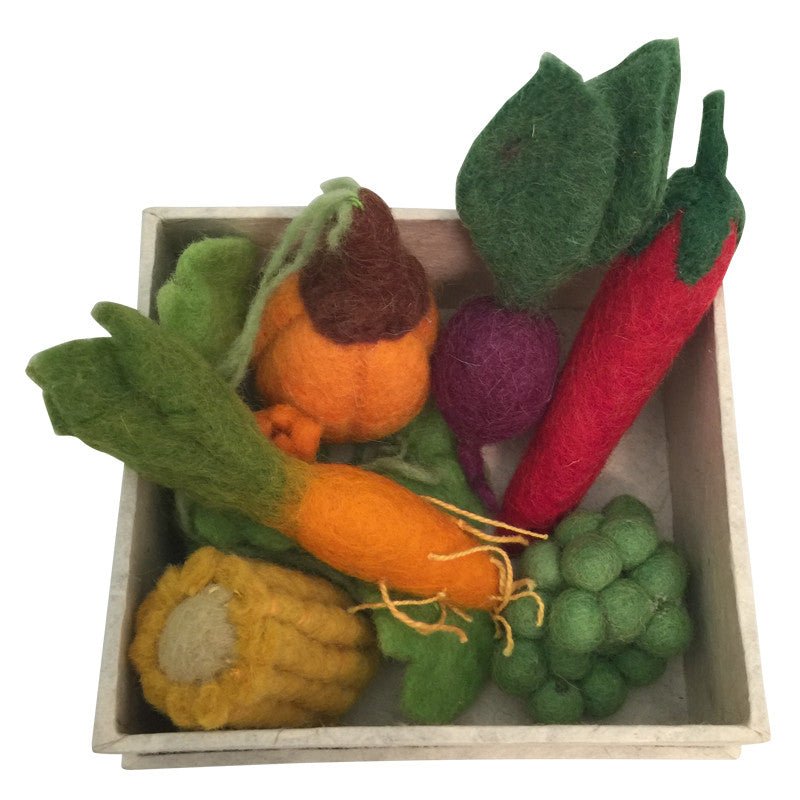 Box with felt vegetables on a white background