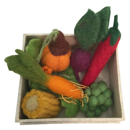 Box with felt vegetables on a white background