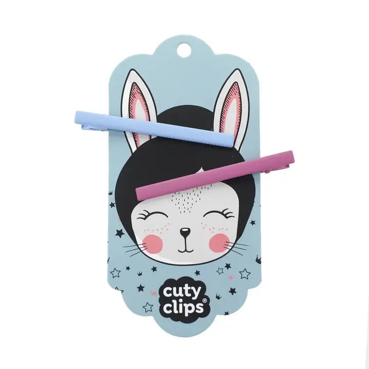 Blue Sky & Fuschia hair clips on Cuty Clips branded packaging with white background