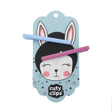 Blue Sky & Fuschia hair clips on Cuty Clips branded packaging with white background