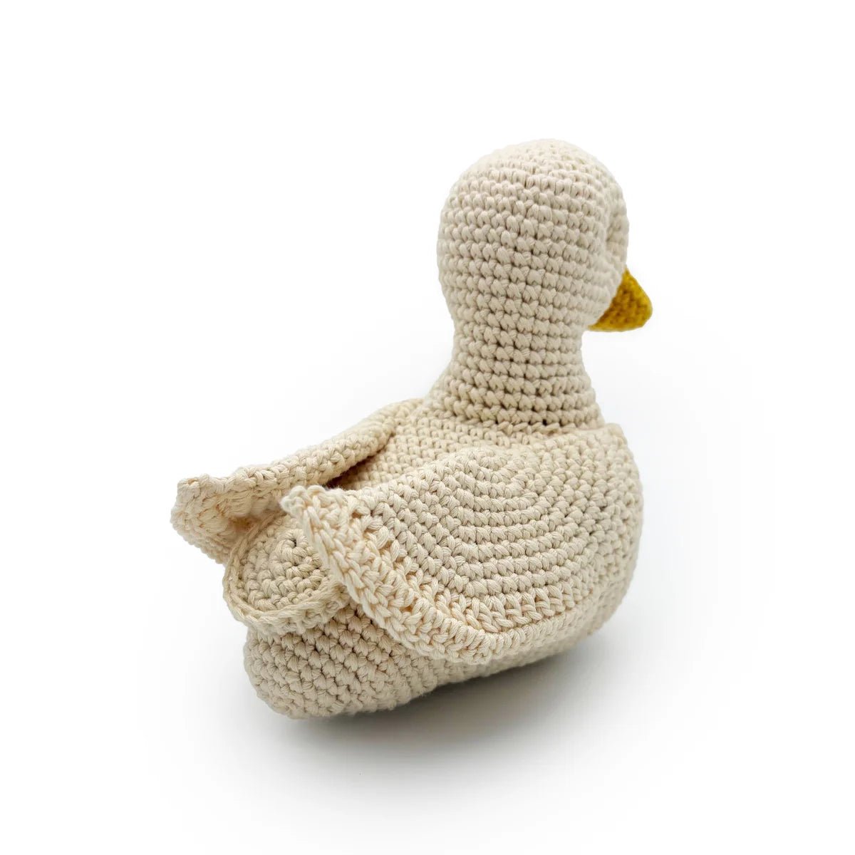 View of crocheted duck toy from the back on a white background