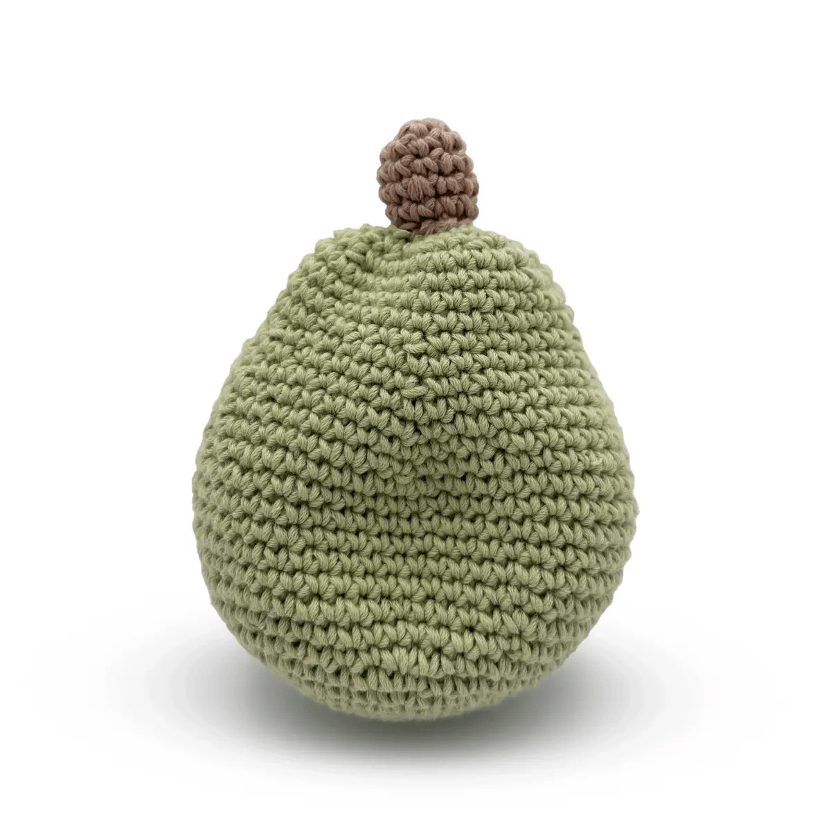 Crocheted pear toy on a white background
