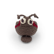 Crocheted ladybug toy with red and grey accents on a white background