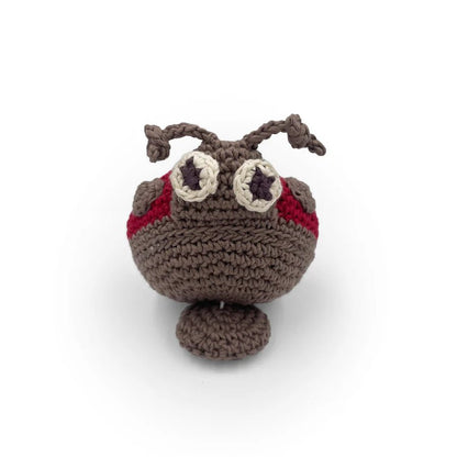 Crocheted ladybug toy with red and grey accents on a white background