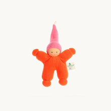 Small orange plush toy with a pink hat on a white background