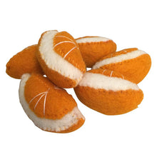 Felted orange slices on a white background