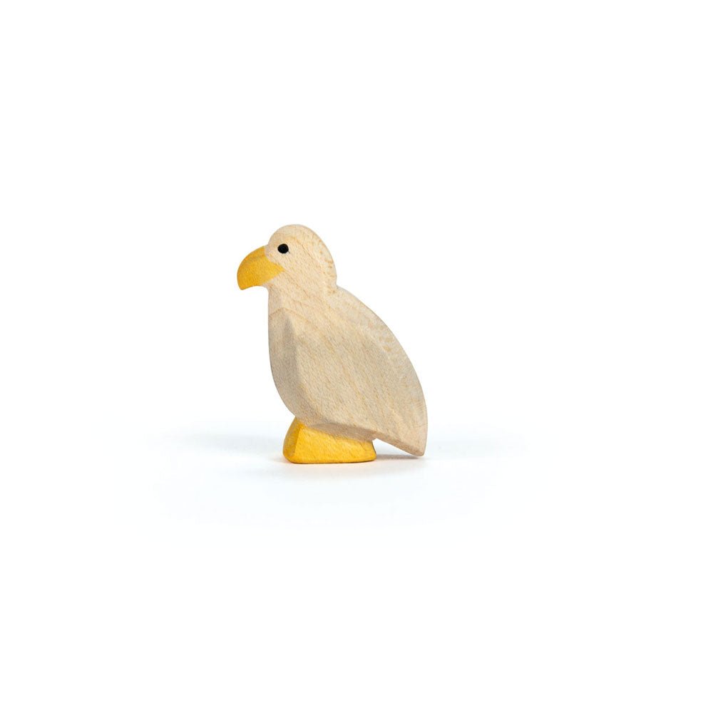 Wooden eaglet figure on a white background