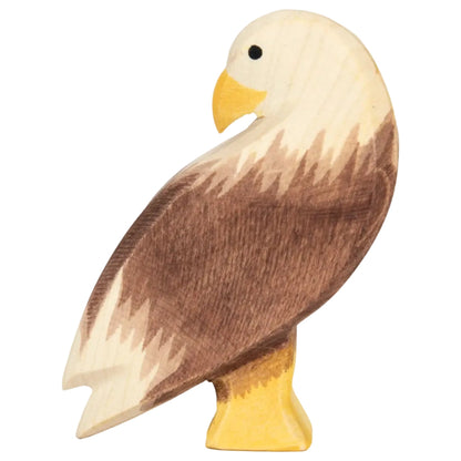 Wooden bald eagle standing figurine on a white background