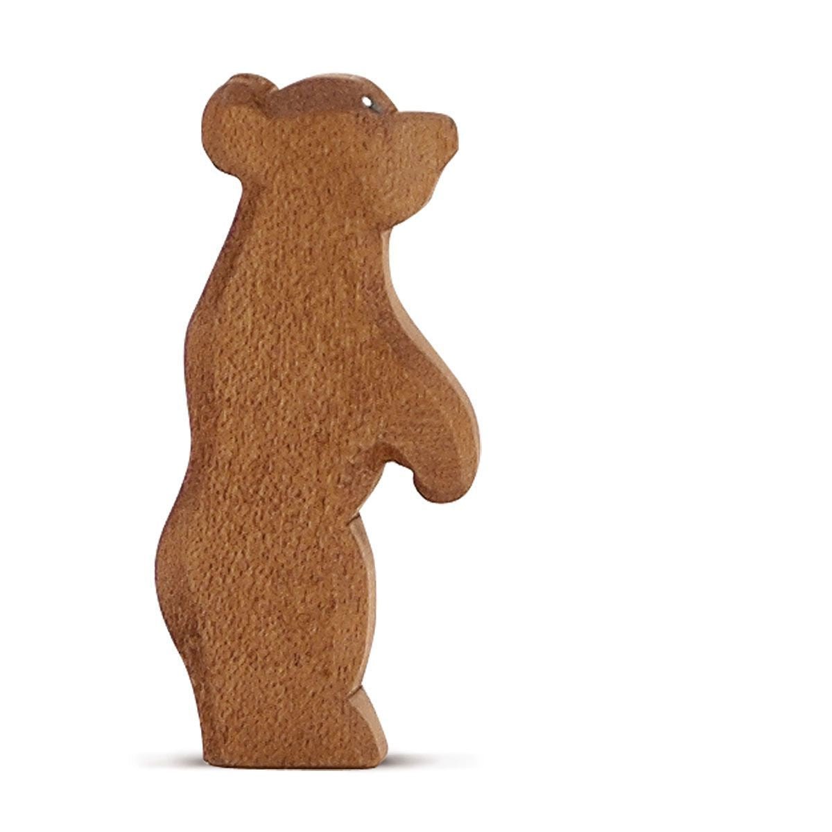 Wooden standing bear figurine on a white background