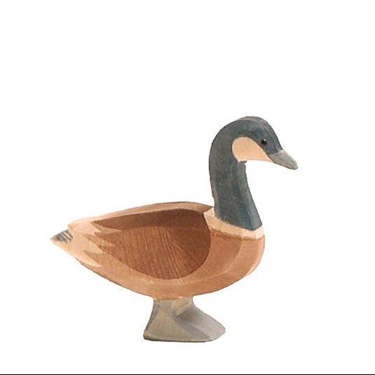 Wooden Canada Goose figurine on a white background