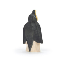 Wooden penguin figurine on a white background