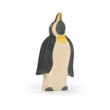 Wooden penguin figure on a white background