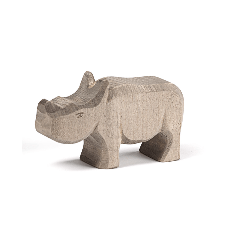 Wooden toy rhino on a white background