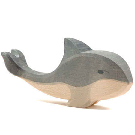 Wooden toy whale on a white background